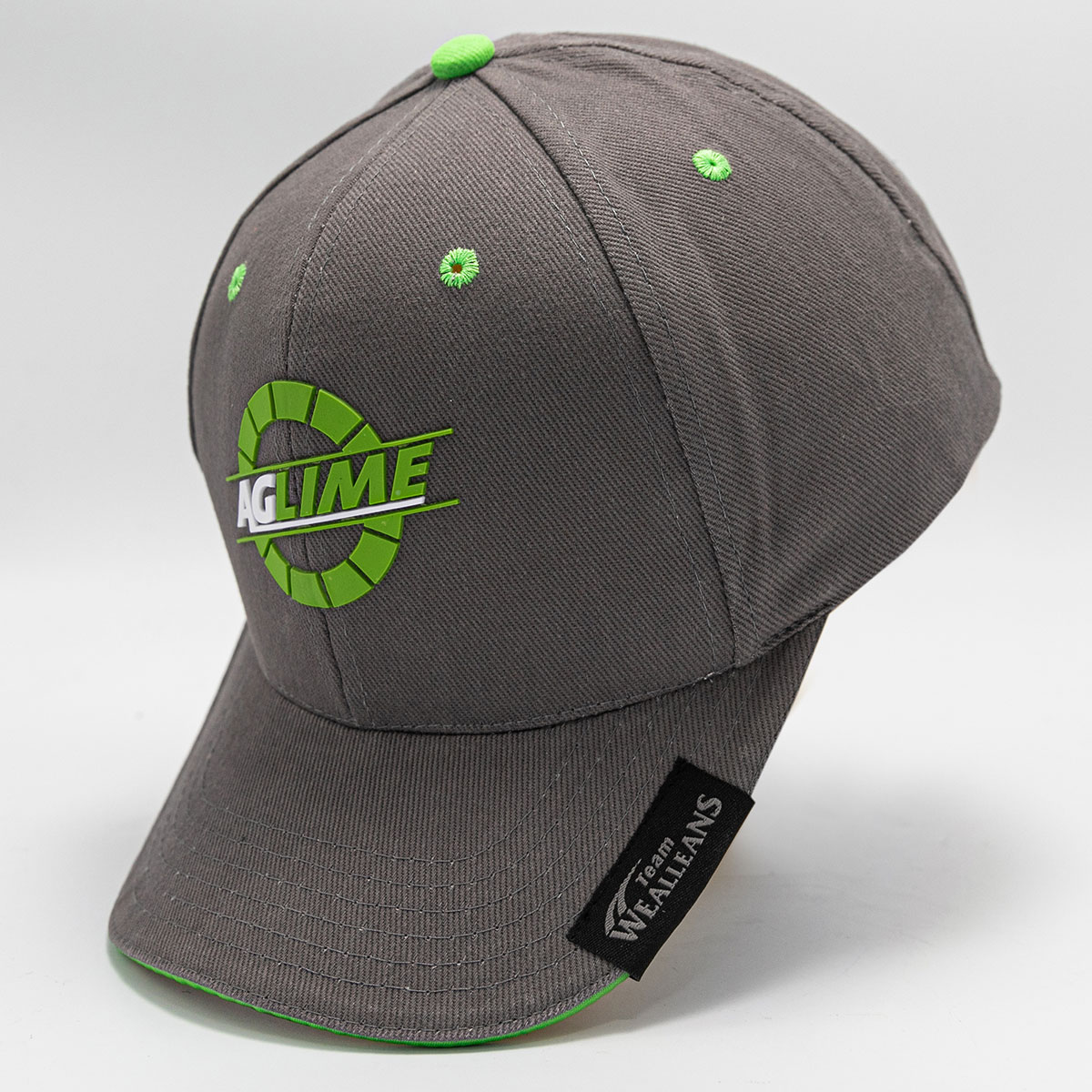 Headwear Slider Grey Cap with Silicone Front Logo, Printed Side Peak Tag, and contrast eyelets and sandwich